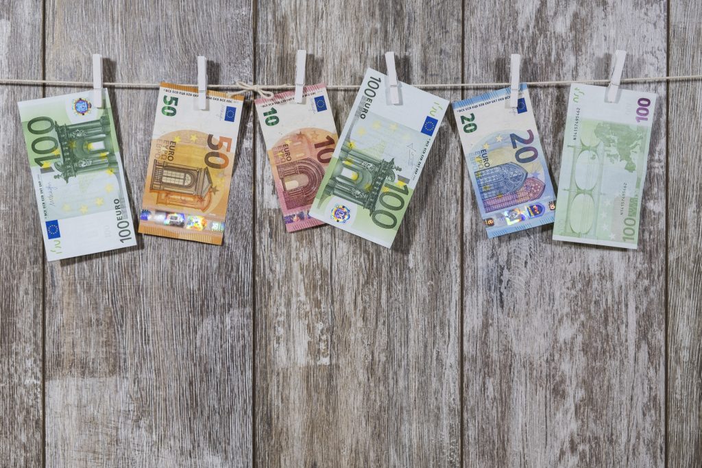 canva euro bills hanging on clothes hangers